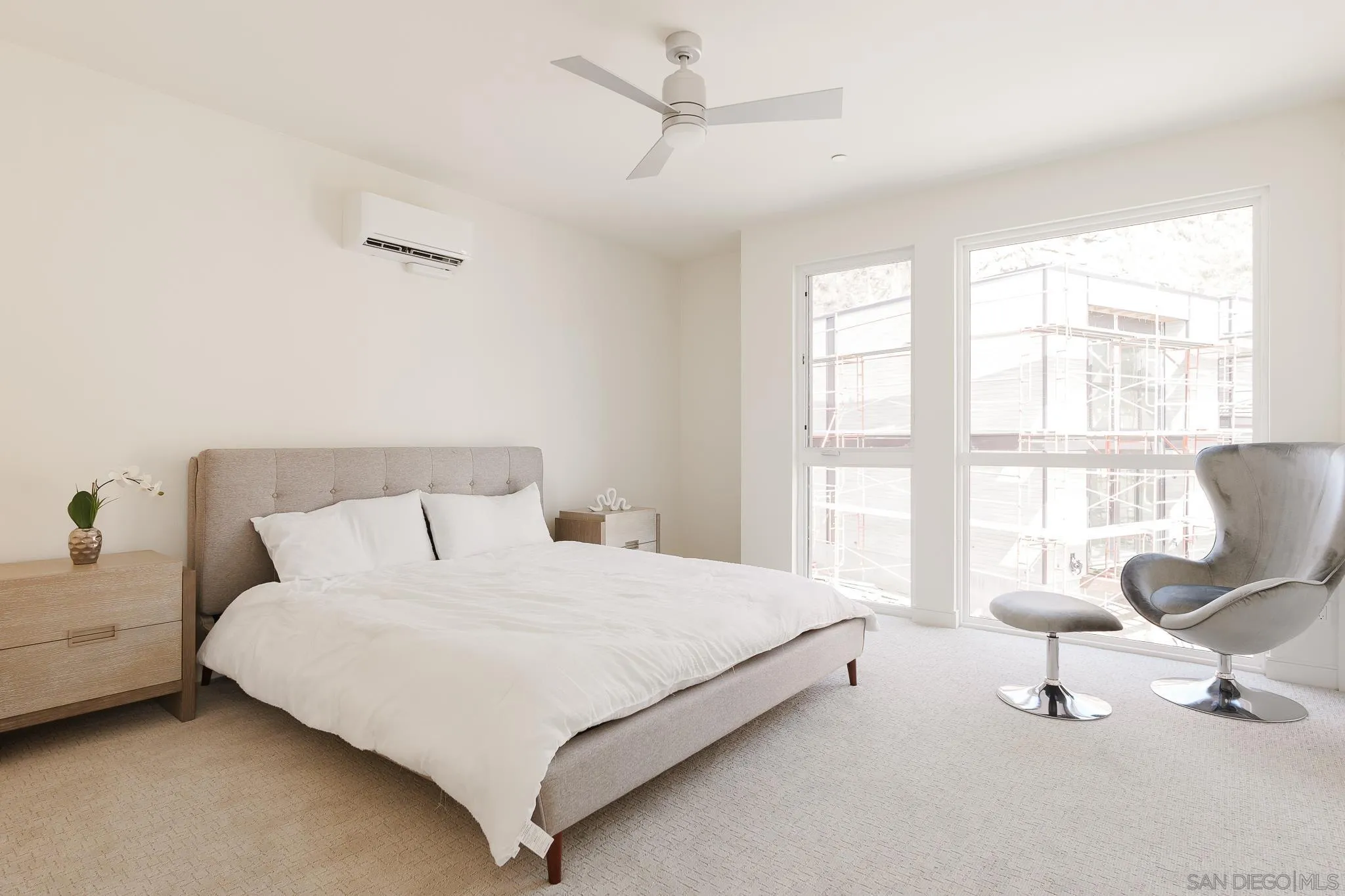 8286 High Street La Mesa, CA 91941 - Photo 17 of 27 a bedroom with a bed chair and a large window
