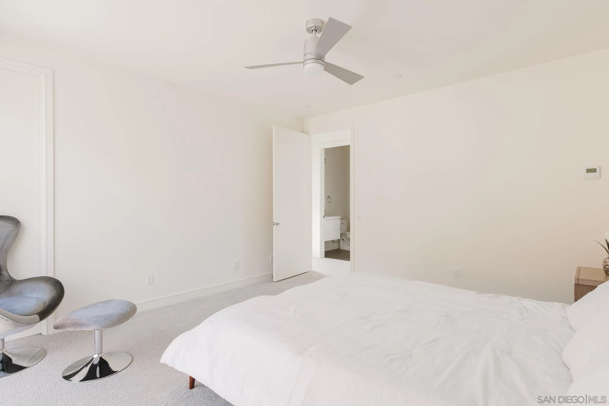 8286 High Street La Mesa, CA 91941 - Photo 19 of 27 a bedroom with a bed and a chair