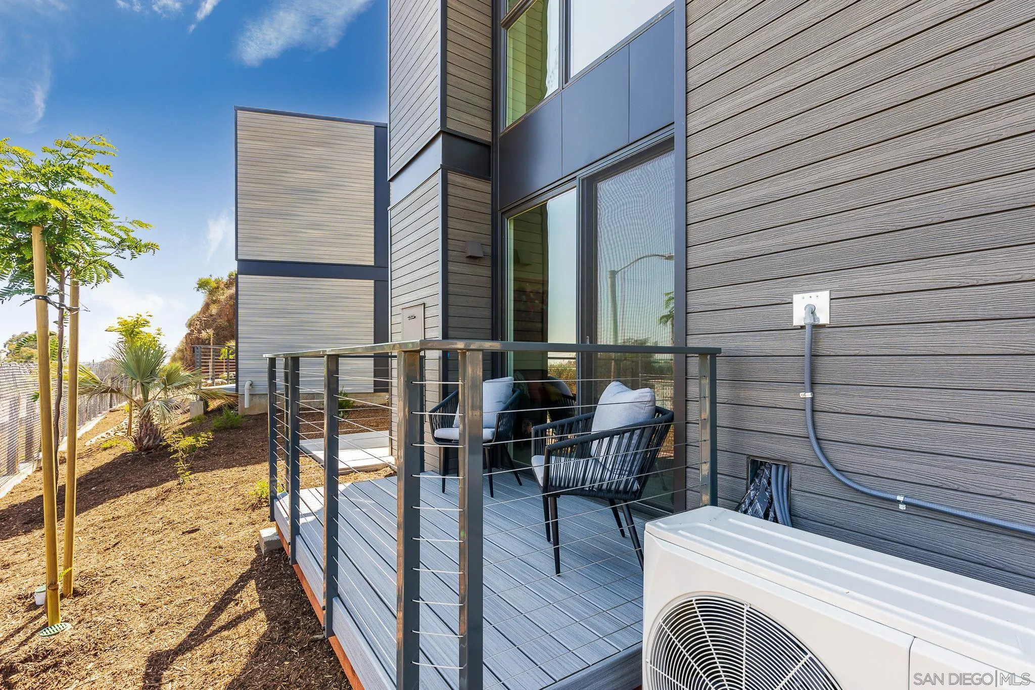 8286 High Street La Mesa, CA 91941 - Photo 21 of 27 a view of a patio with couches and table and chairs and wooden fence