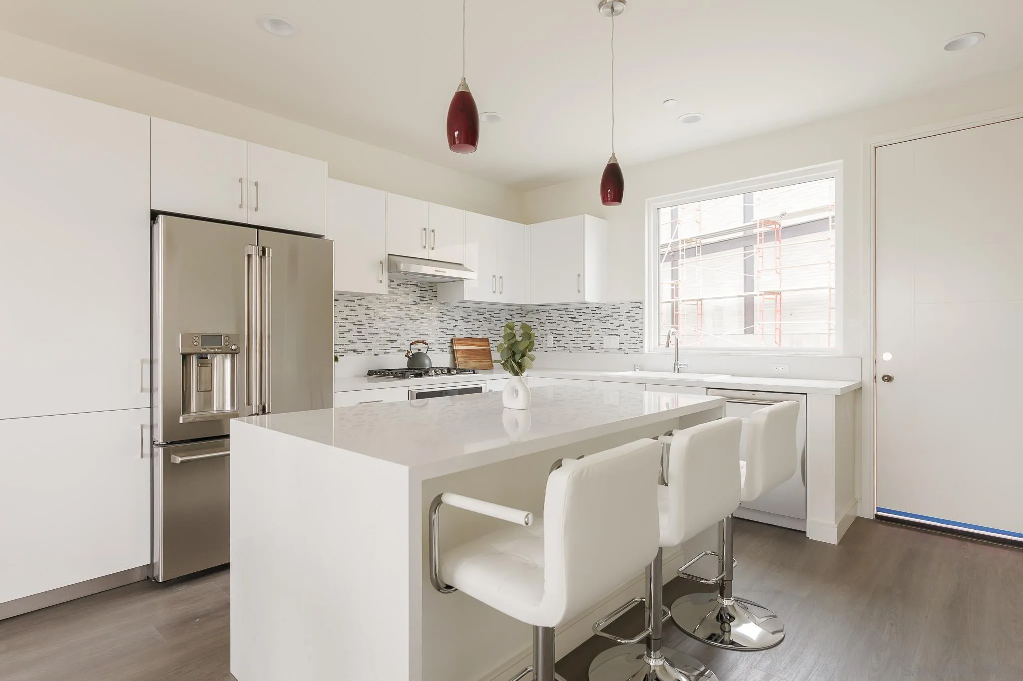 8286 High Street La Mesa, CA 91941 - Photo 3 of 27 a kitchen with stainless steel appliances granite countertop a sink a stove and a refrigerator