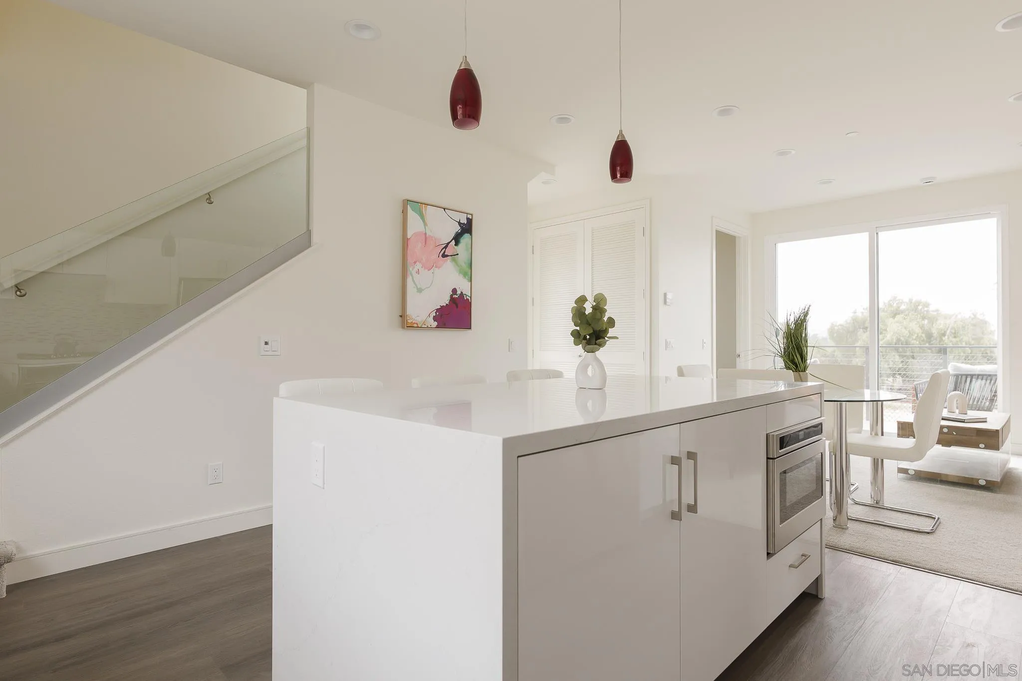 8286 High Street La Mesa, CA 91941 - Photo 4 of 27 a kitchen with stainless steel appliances a white cabinets and a window