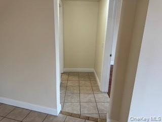 390 Main Street, Unit 3 Beacon, NY 12508 - Photo 5 of 8 Hall featuring light tile patterned floors and baseboards