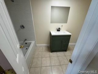 390 Main Street, Unit 3 Beacon, NY 12508 - Photo 7 of 8 Bathroom with tile patterned flooring, shower / tub combination, vanity, and baseboards