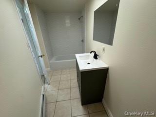390 Main Street, Unit 3 Beacon, NY 12508 - Photo 8 of 8 Bathroom with shower / bathtub combination, tile patterned flooring, baseboards, and vanity