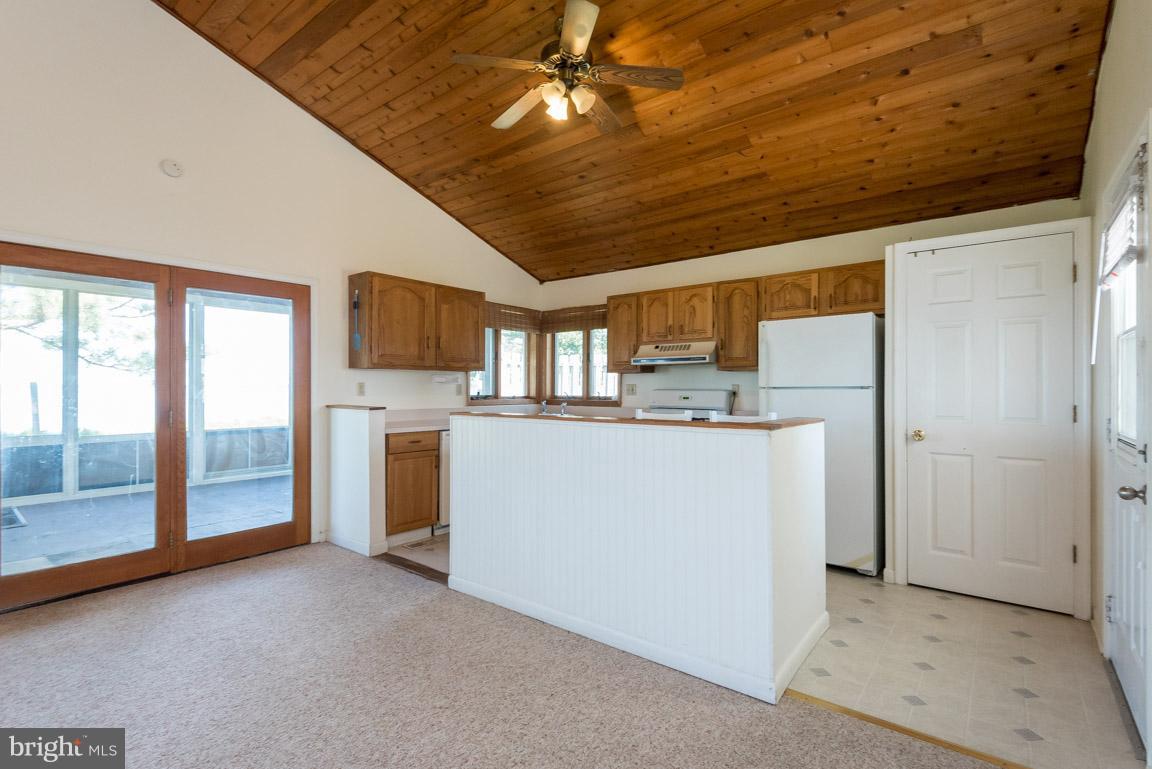 916 Long Point Road Grasonville, MD 21638 - Photo 11 of 27 Kitchen with View to Screened Porch