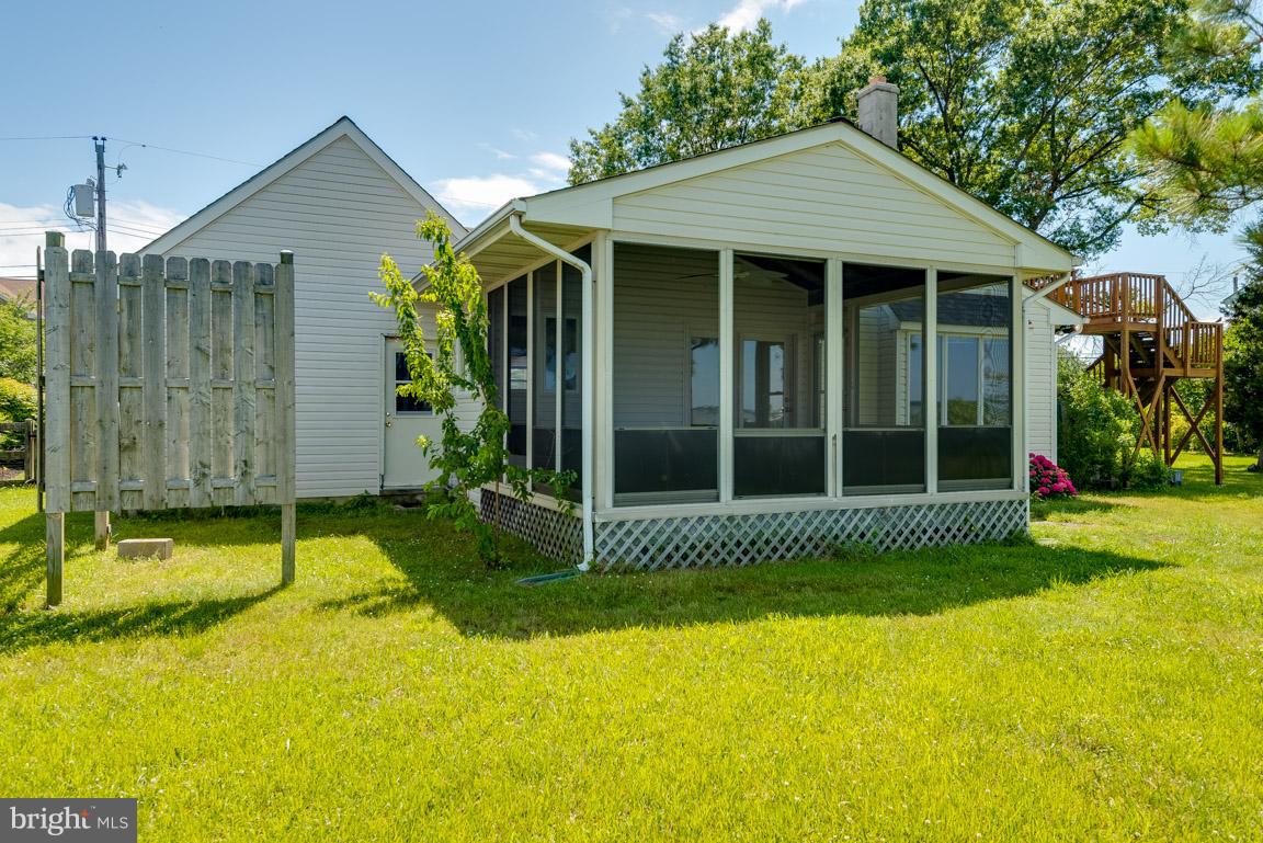 916 Long Point Road Grasonville, MD 21638 - Photo 6 of 27 Exterior Rear of Dwelling and Detached Garage