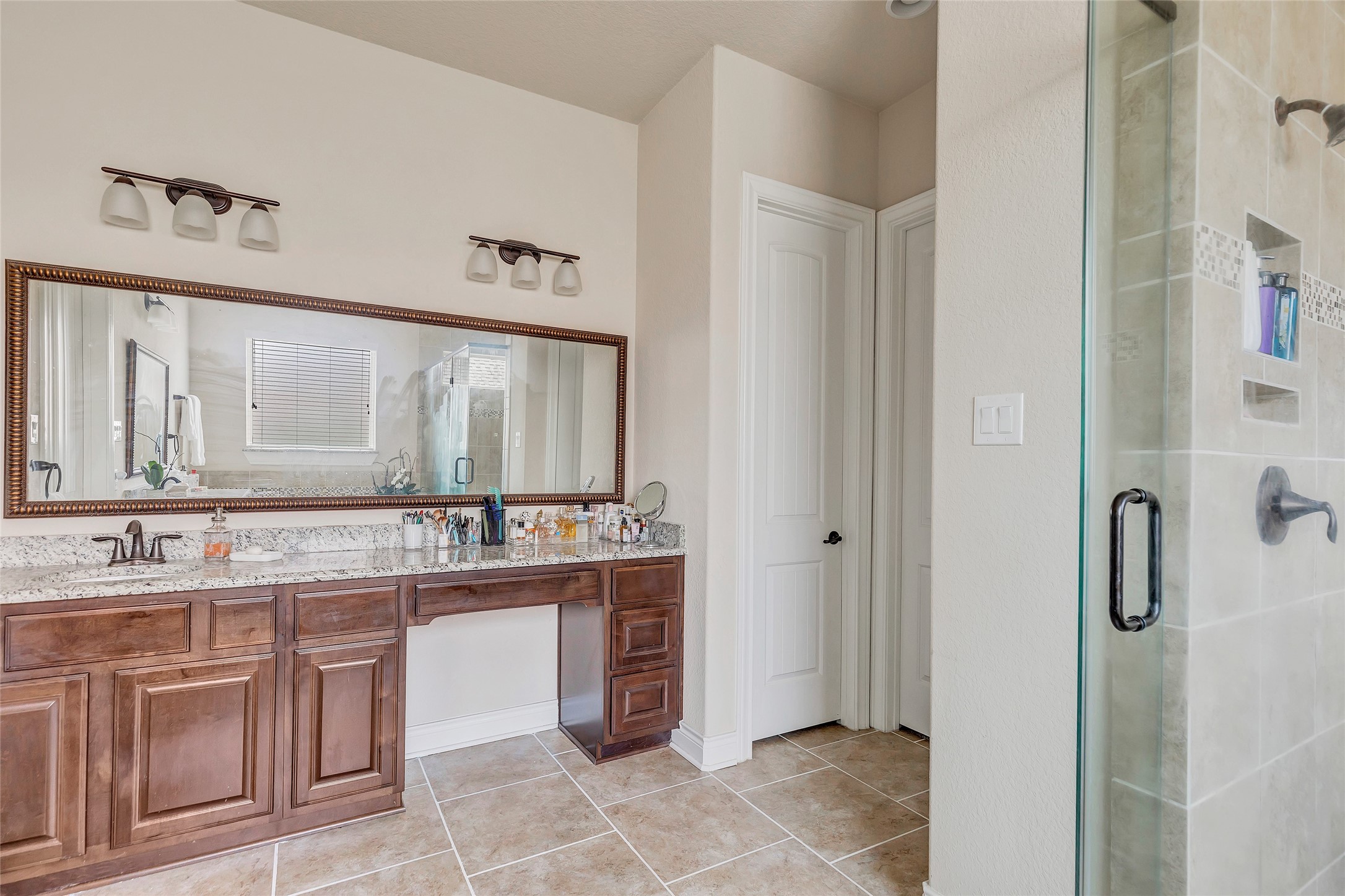 18115 Stari Most Lane Houston, TX 77044 - Photo 24 of 35 a bathroom with a sink and a mirror