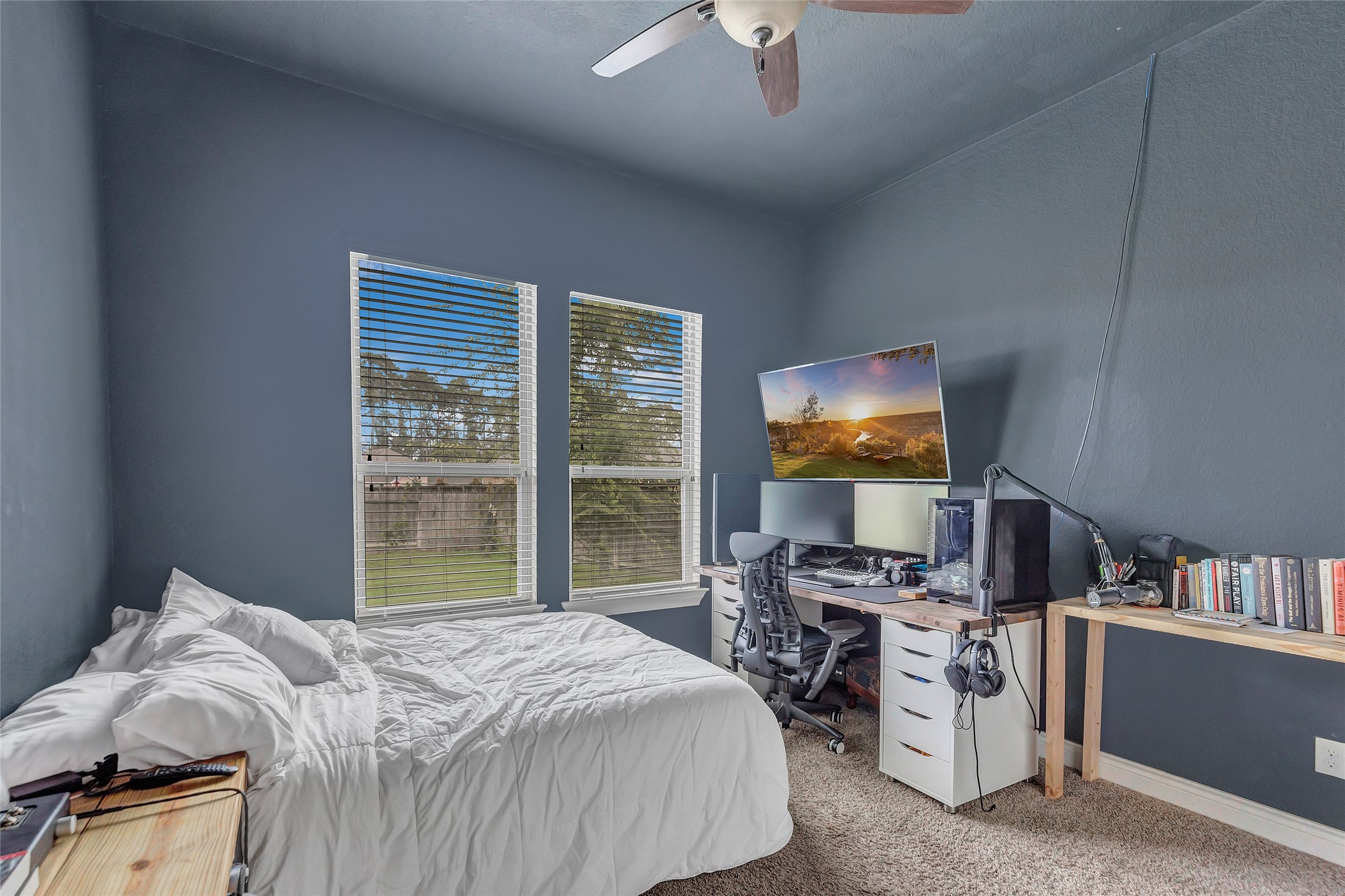 18115 Stari Most Lane Houston, TX 77044 - Photo 27 of 35 a bedroom with a bed and a bookshelf