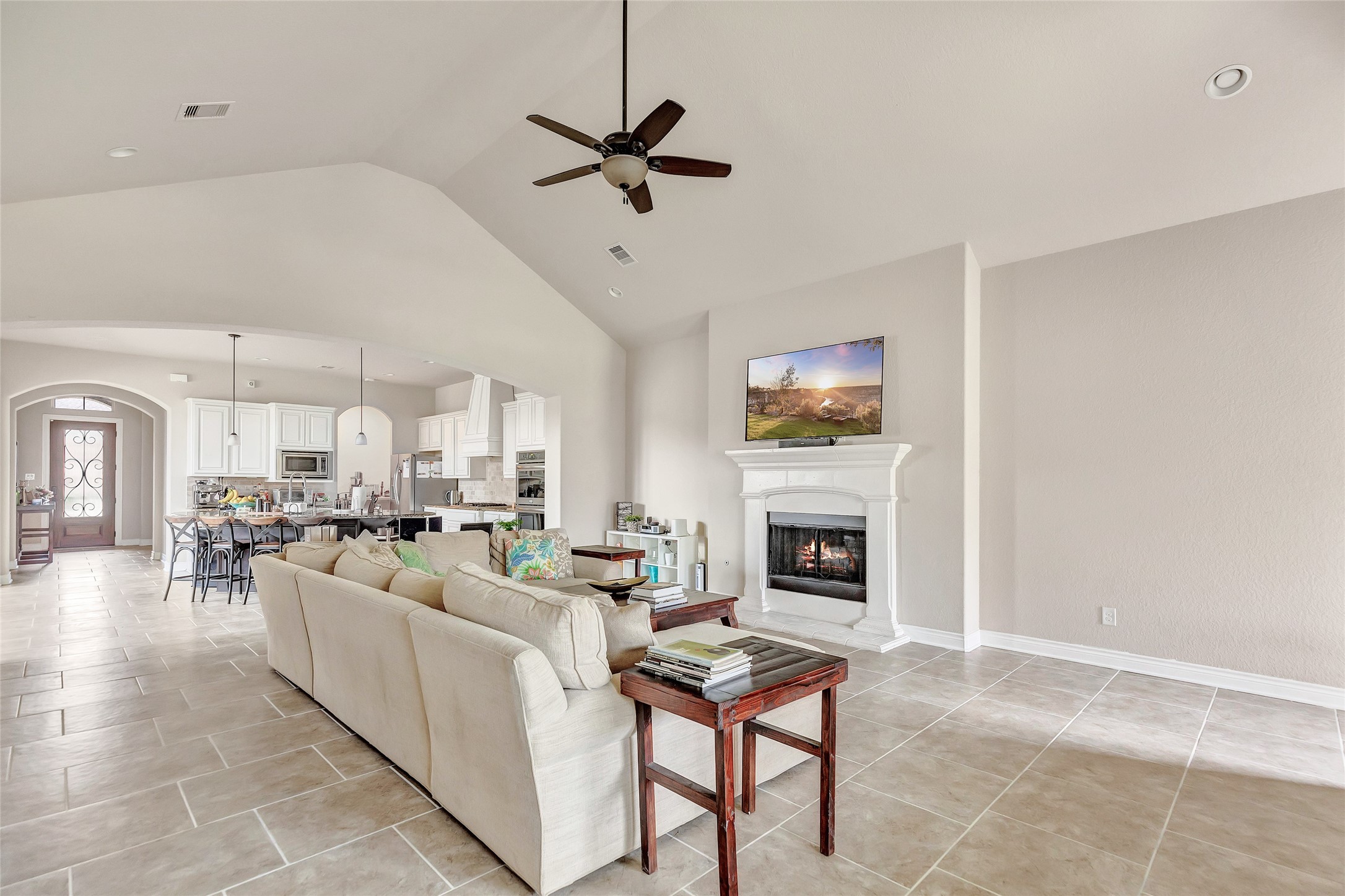 18115 Stari Most Lane Houston, TX 77044 - Photo 4 of 35 a living room with furniture a fireplace and a flat screen tv