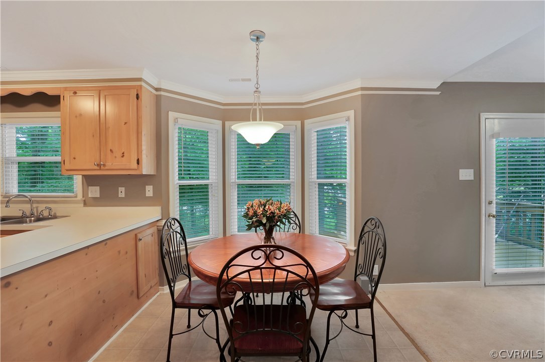 14602 Ridge Point Drive Midlothian, VA 23112 - Photo 12 of 25 a view of a dining room with furniture window and outside view