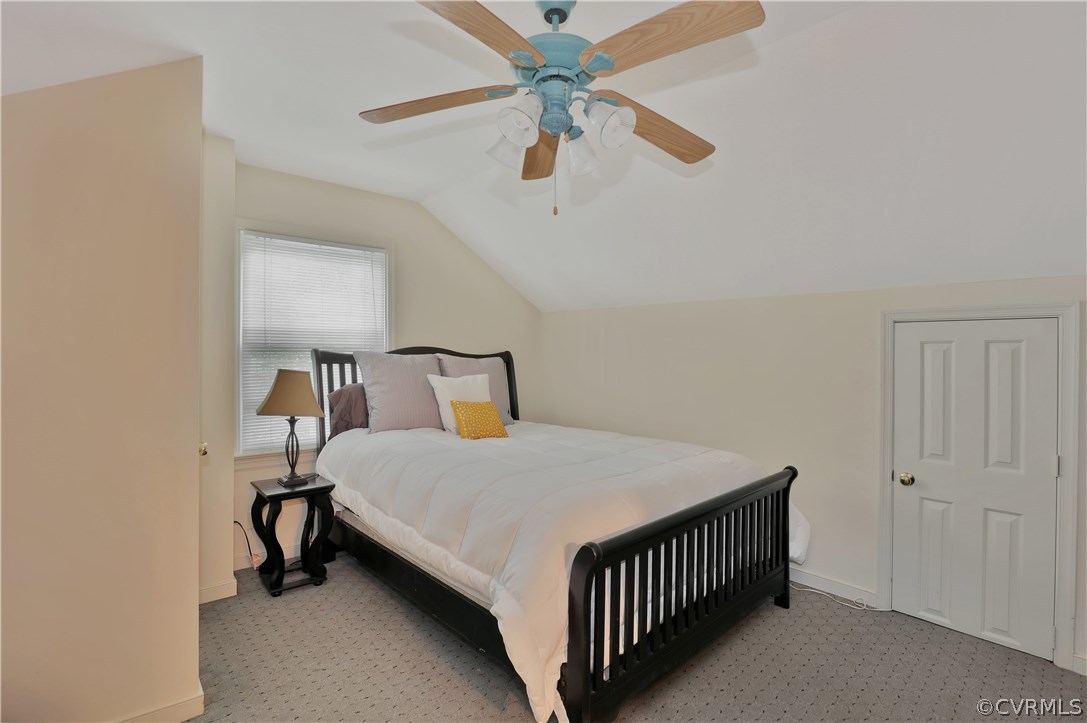 14602 Ridge Point Drive Midlothian, VA 23112 - Photo 16 of 25 a bedroom with a bed and a chandelier