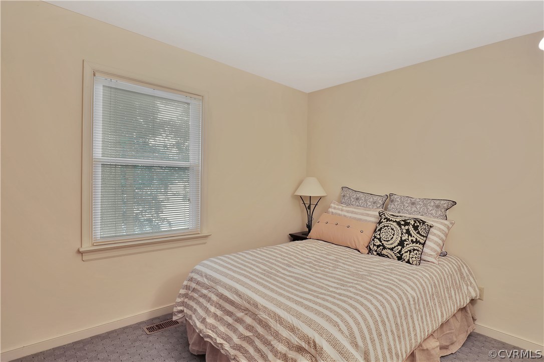 14602 Ridge Point Drive Midlothian, VA 23112 - Photo 17 of 25 a bedroom with a bed and a window
