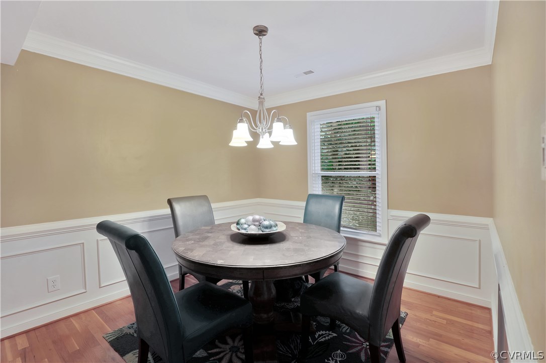 14602 Ridge Point Drive Midlothian, VA 23112 - Photo 6 of 25 a view of a dining room with furniture window and wooden floor
