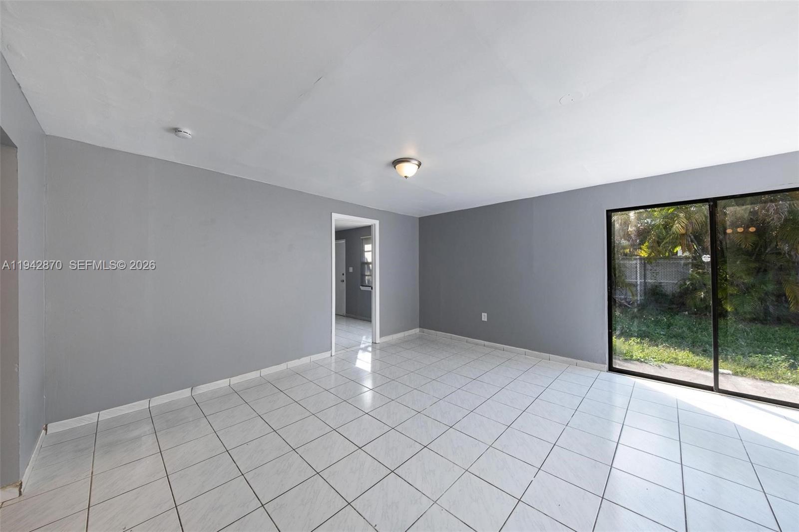 2348 Southwest 138th Place Miami, FL 33175 - Photo 18 of 35 a view of an empty room with window