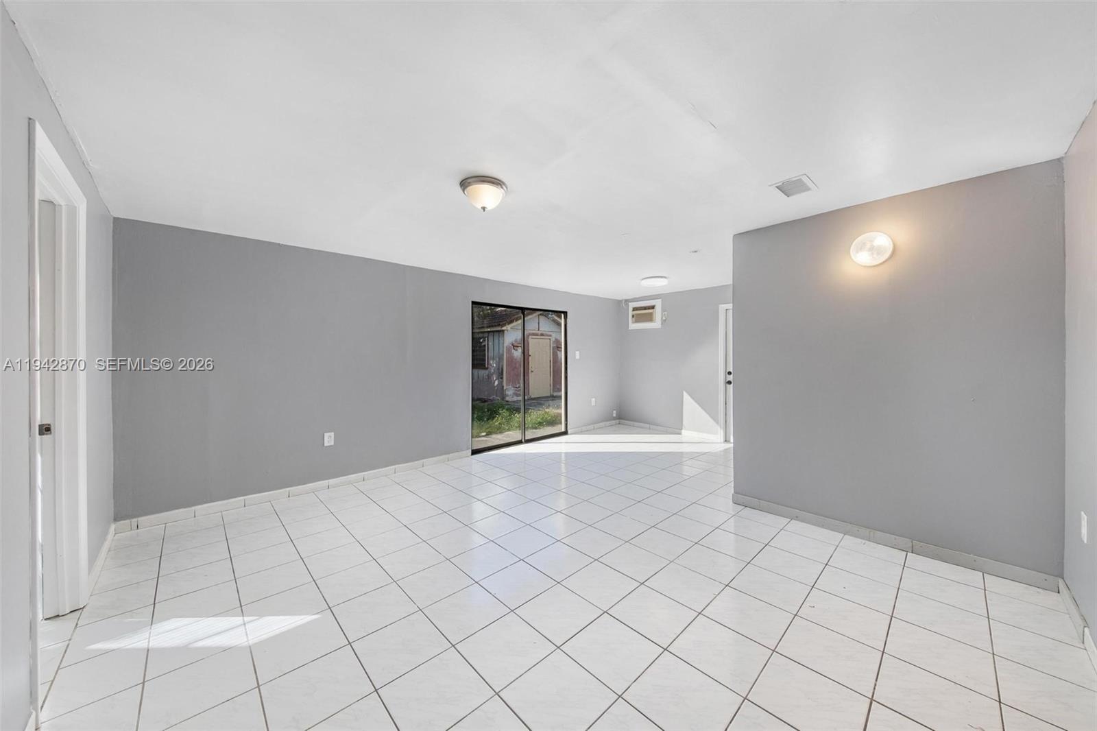 2348 Southwest 138th Place Miami, FL 33175 - Photo 19 of 35 a view of an empty room and window