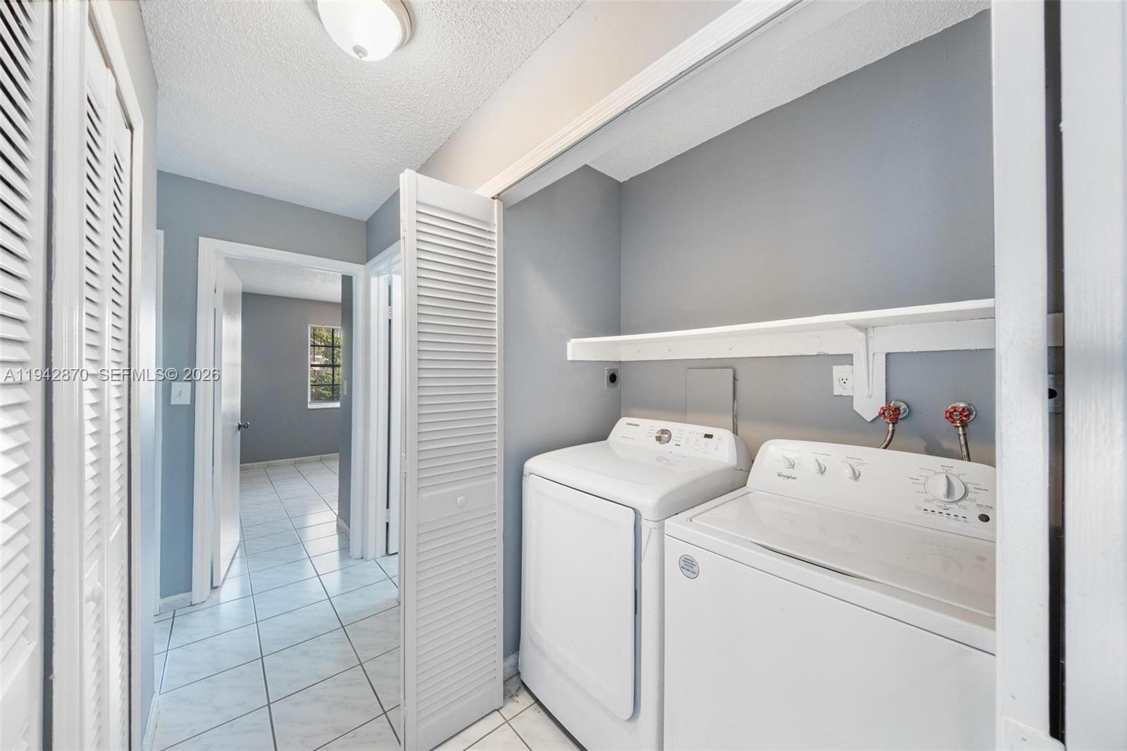 2348 Southwest 138th Place Miami, FL 33175 - Photo 25 of 35 a view of storage and utility room with washer and dryer