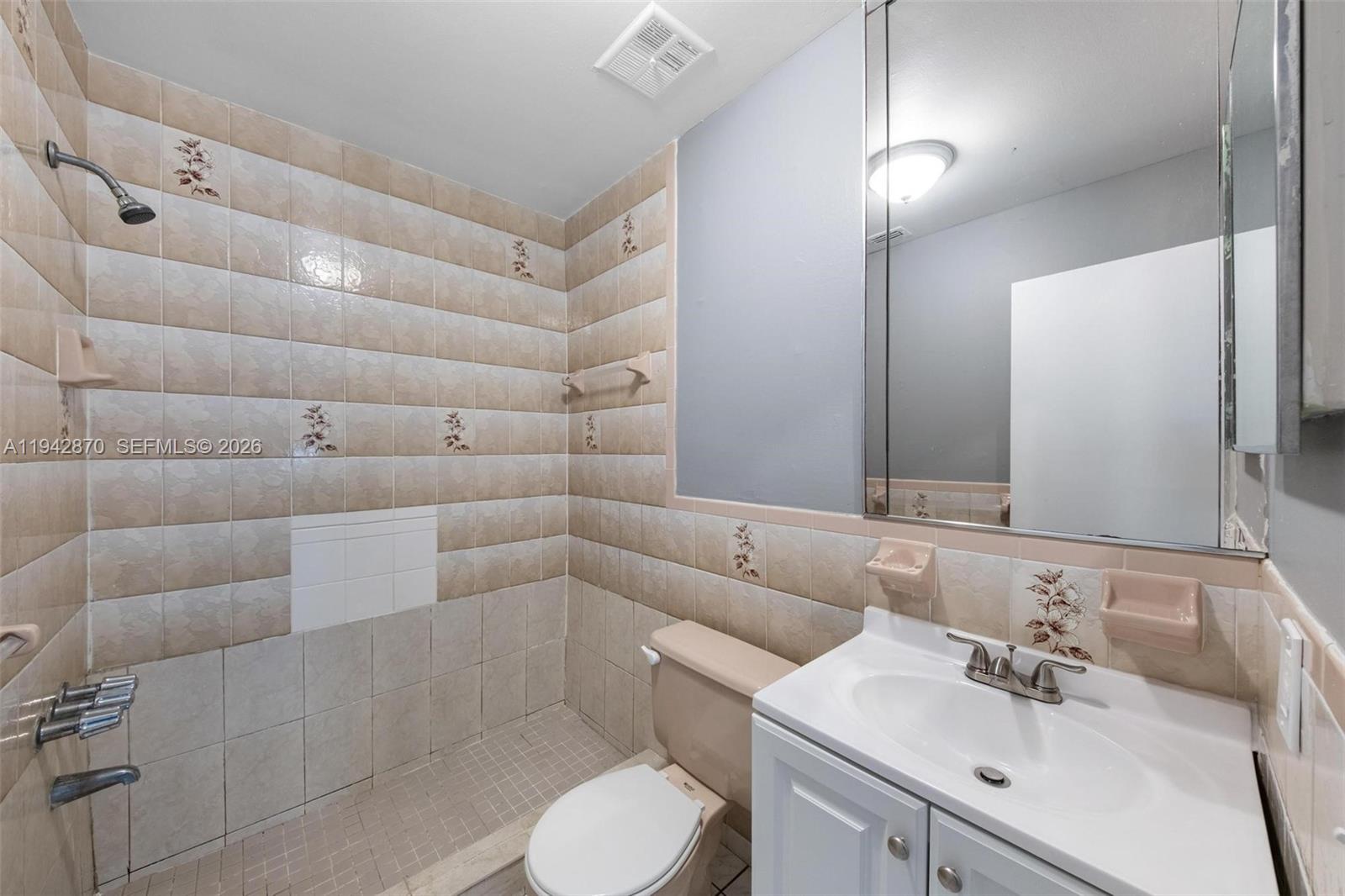 2348 Southwest 138th Place Miami, FL 33175 - Photo 28 of 35 a bathroom with a sink toilet and shower