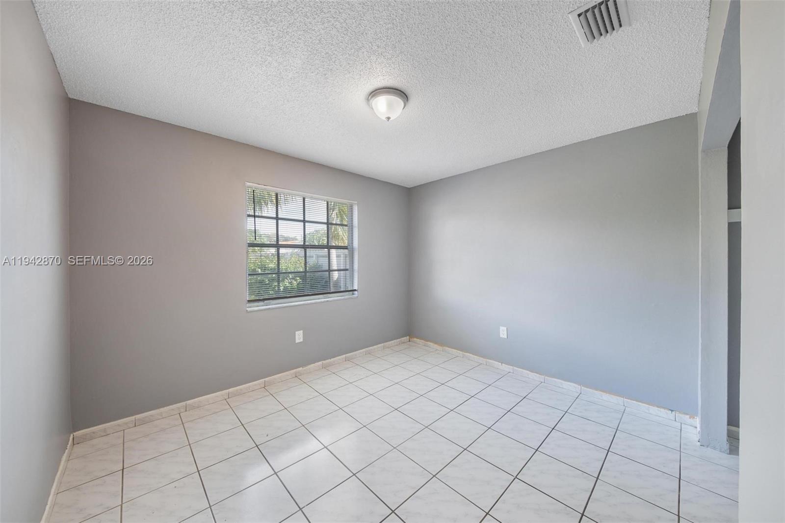 2348 Southwest 138th Place Miami, FL 33175 - Photo 29 of 35 a view of an empty room and window