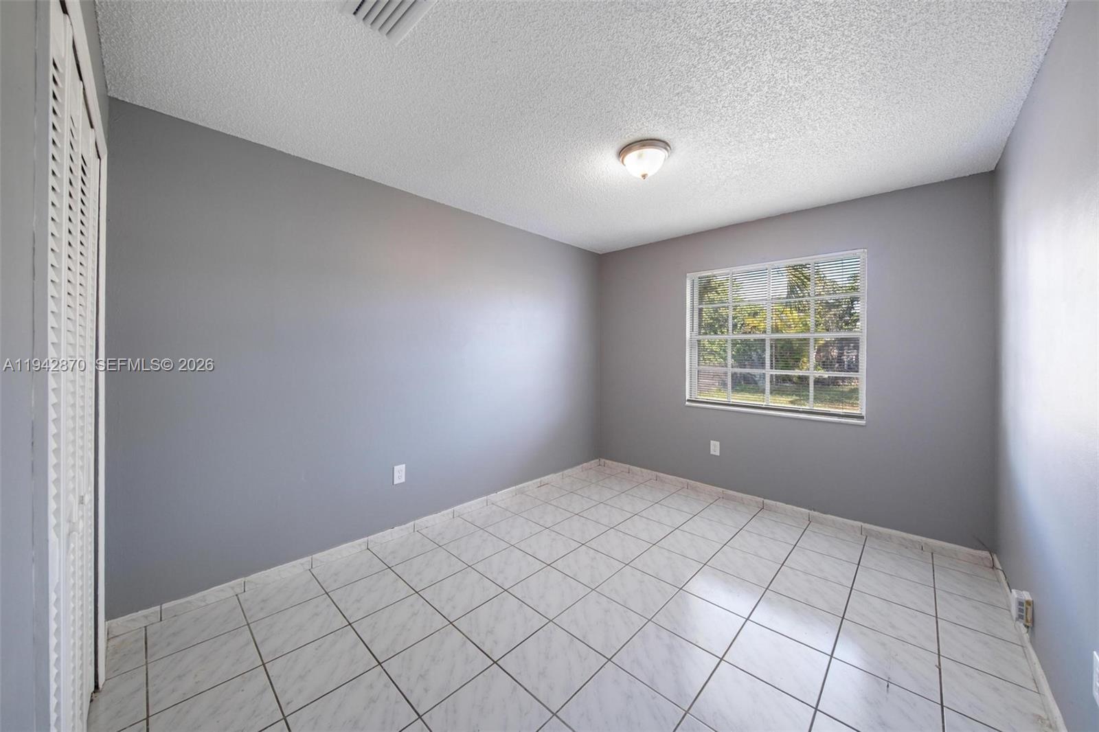 2348 Southwest 138th Place Miami, FL 33175 - Photo 35 of 35 a view of an empty room and window