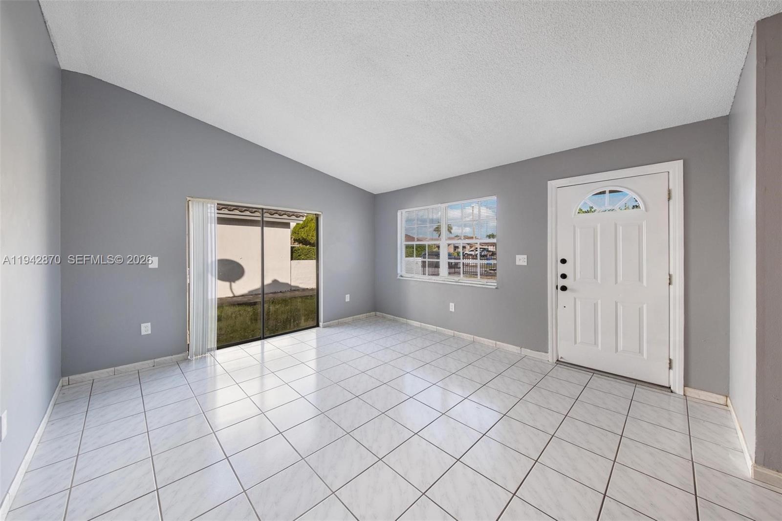 2348 Southwest 138th Place Miami, FL 33175 - Photo 5 of 35 a view of an empty room and window