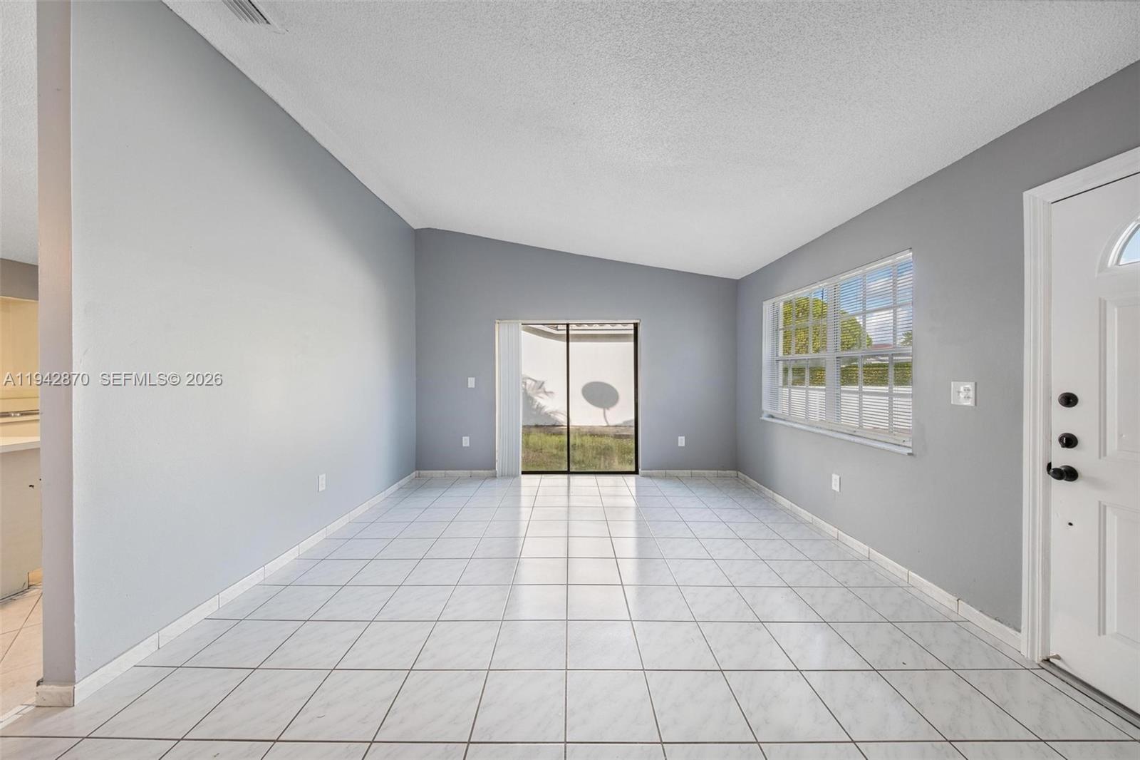 2348 Southwest 138th Place Miami, FL 33175 - Photo 6 of 35 a view of an empty room with window