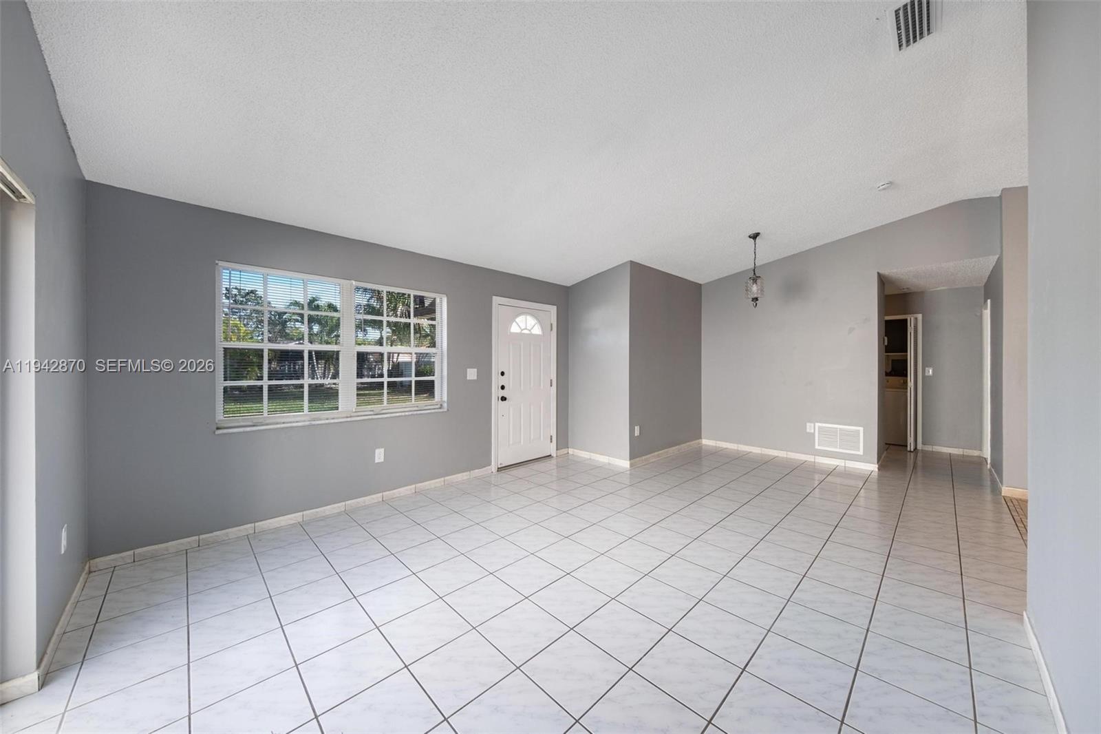 2348 Southwest 138th Place Miami, FL 33175 - Photo 9 of 35 a view of an empty room with a window