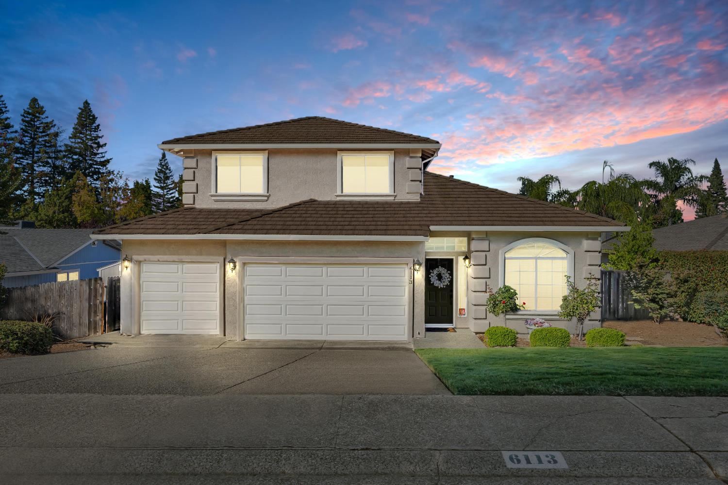 6113 Kifisia Way Fair Oaks, CA 95628 - Photo 1 of 67 a front view of a house with a garden and plants