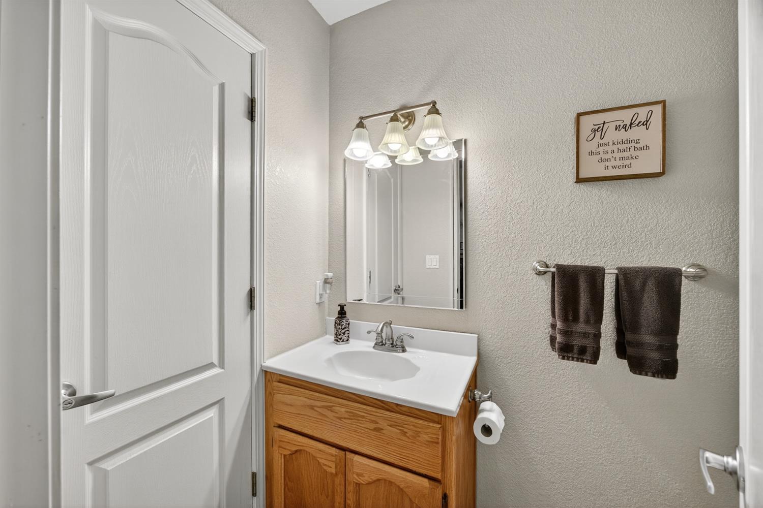6113 Kifisia Way Fair Oaks, CA 95628 - Photo 21 of 67 a bathroom with a sink vanity and mirror