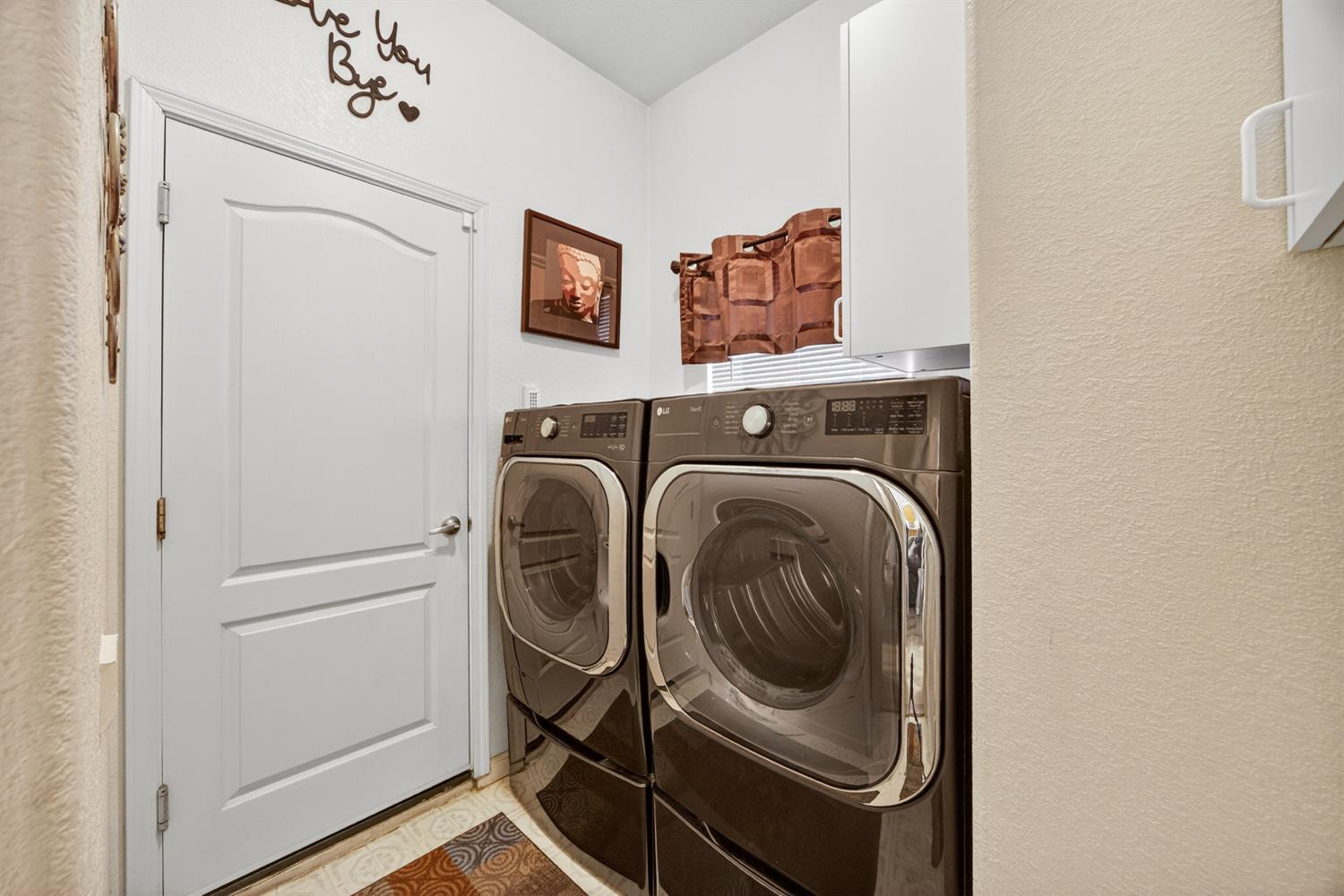 6113 Kifisia Way Fair Oaks, CA 95628 - Photo 23 of 67 a utility room with dryer and washer