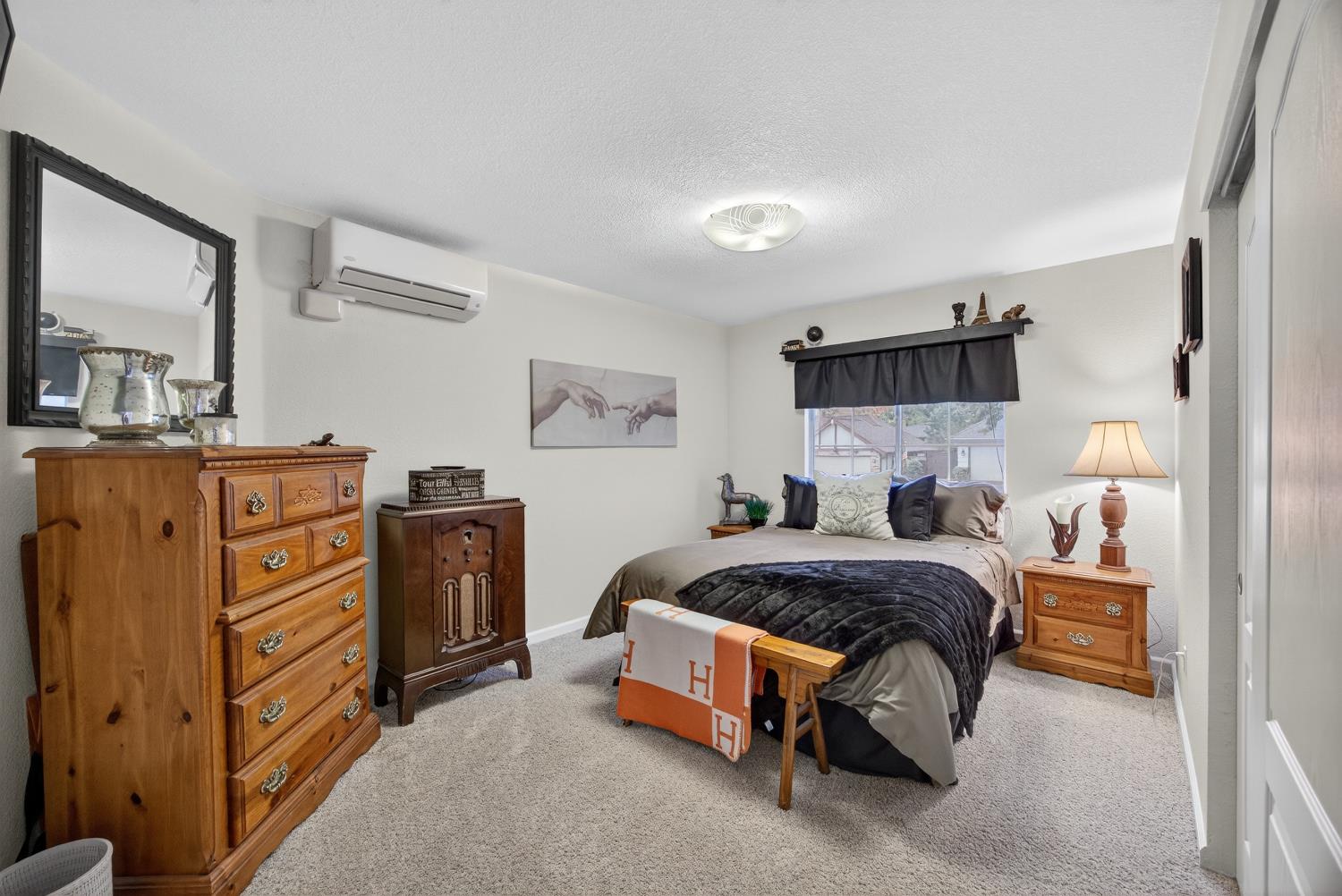 6113 Kifisia Way Fair Oaks, CA 95628 - Photo 31 of 67 a bedroom with a bed and a dresser in it