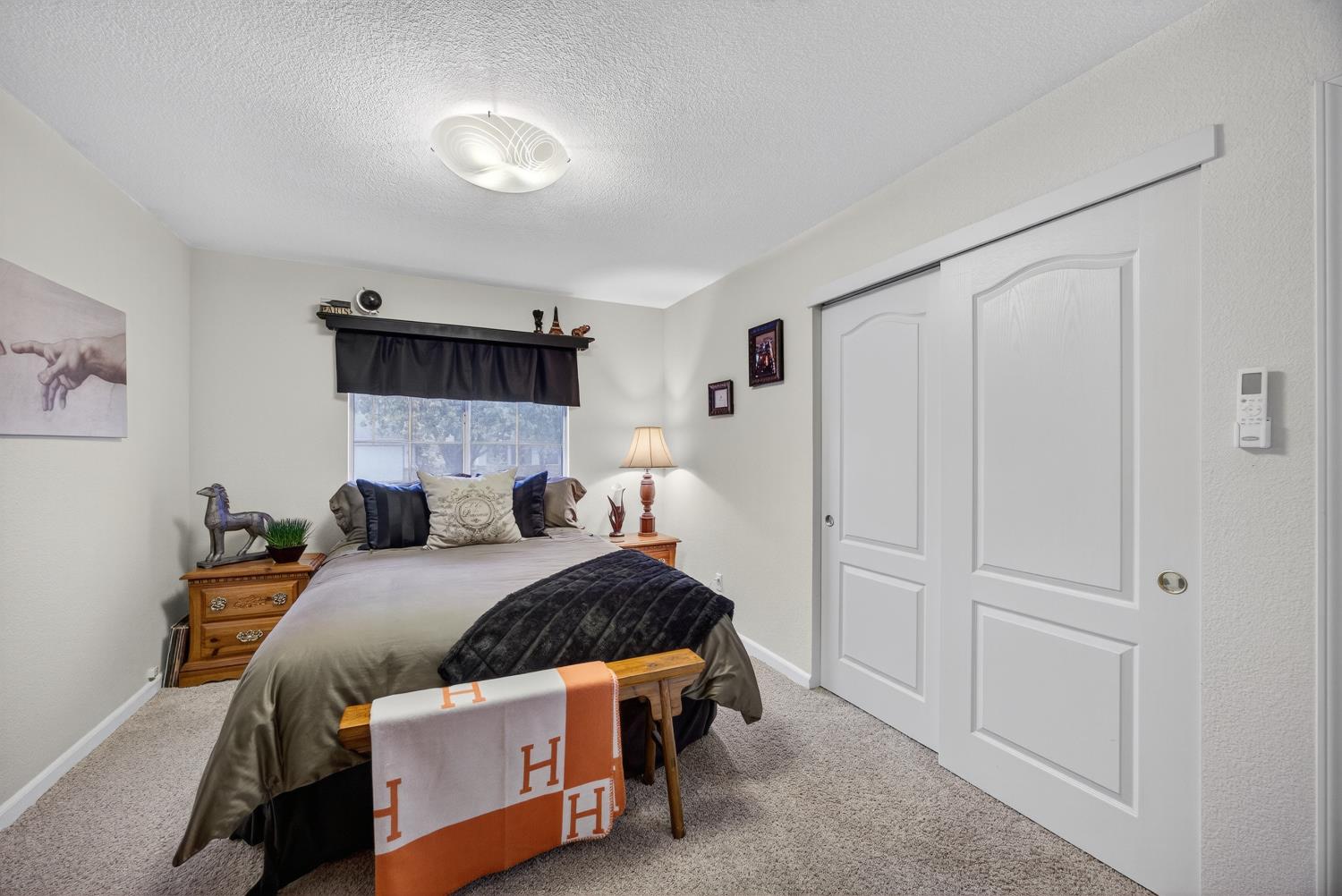 6113 Kifisia Way Fair Oaks, CA 95628 - Photo 32 of 67 a bedroom with a bed and a cabinets