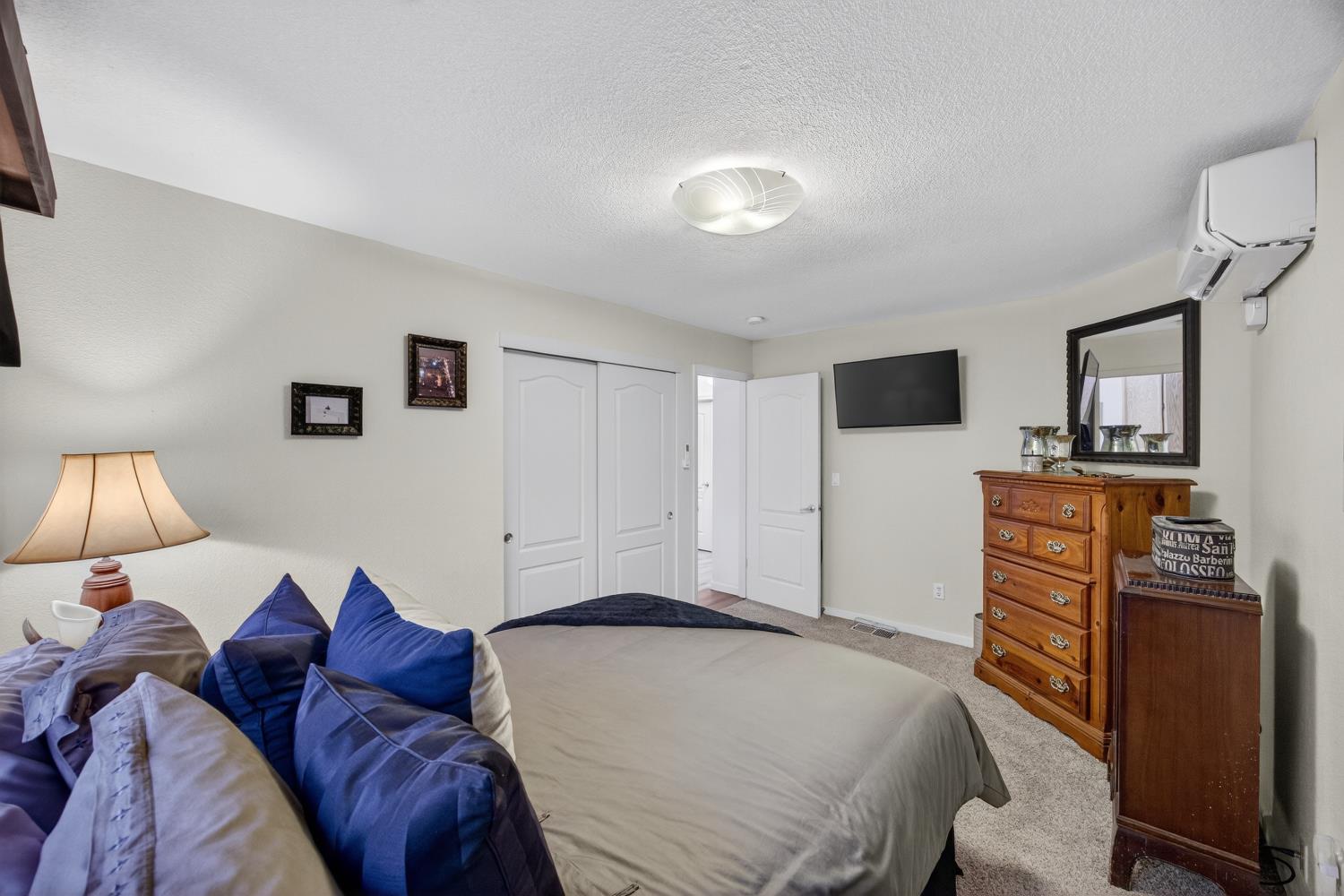 6113 Kifisia Way Fair Oaks, CA 95628 - Photo 33 of 67 a bedroom with a bed and a television