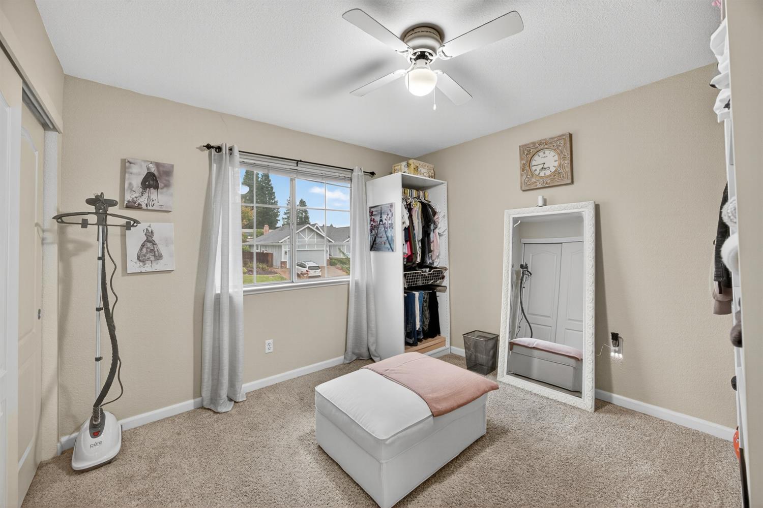 6113 Kifisia Way Fair Oaks, CA 95628 - Photo 34 of 67 a living room with furniture a ceiling fan and a rug