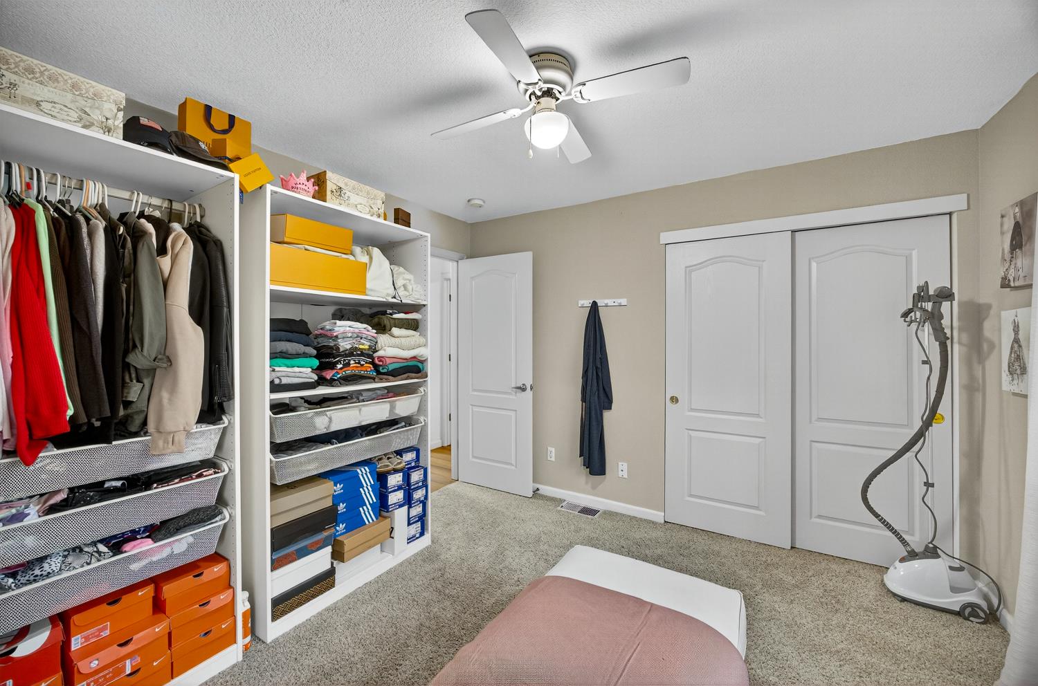 6113 Kifisia Way Fair Oaks, CA 95628 - Photo 35 of 67 a view of walk in closet with clothes and shoes