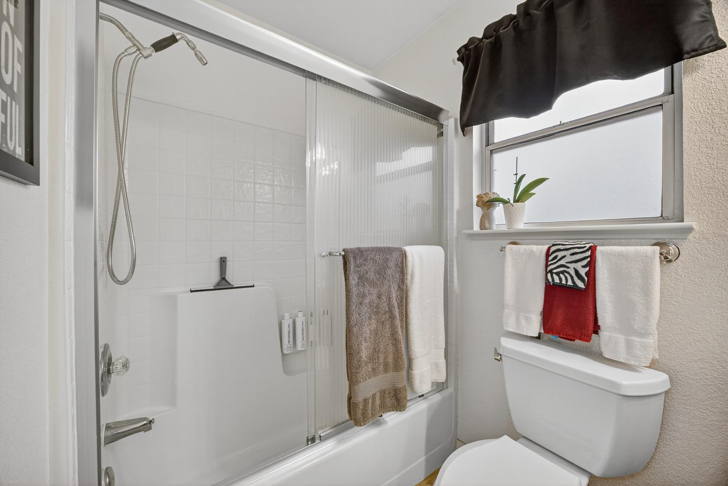 6113 Kifisia Way Fair Oaks, CA 95628 - Photo 37 of 67 a white toilet sitting next to a bath tub shower