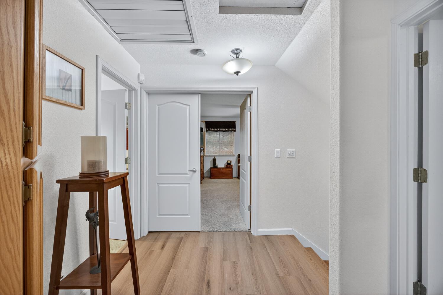 6113 Kifisia Way Fair Oaks, CA 95628 - Photo 39 of 67 a view of a hallway view with wooden floor and staircase