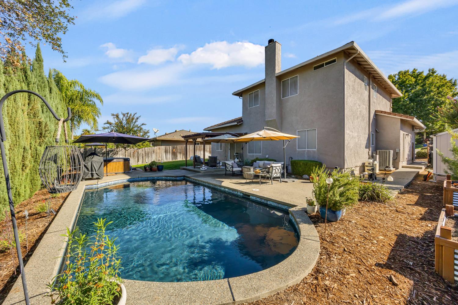 6113 Kifisia Way Fair Oaks, CA 95628 - Photo 41 of 67 a view of a house with swimming pool patio and sitting area