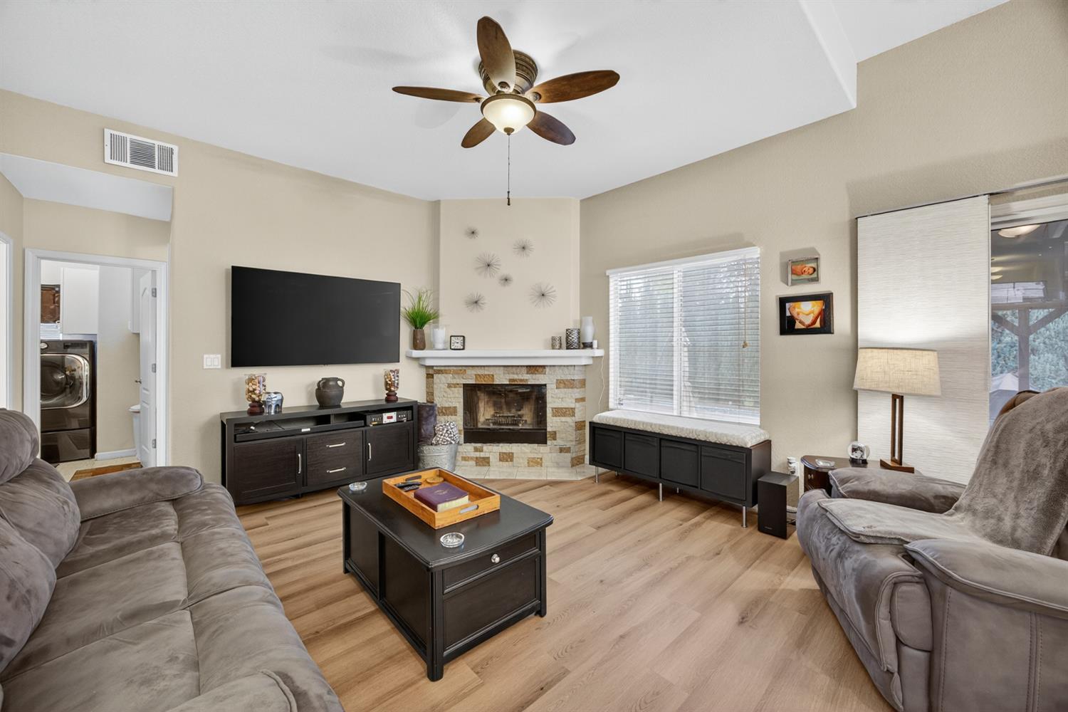 6113 Kifisia Way Fair Oaks, CA 95628 - Photo 10 of 67 a living room with furniture fireplace and a flat screen tv