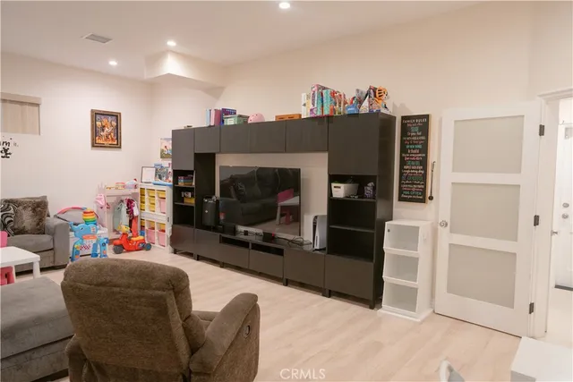 a bathroom with a double vanity sink mirror and toilet