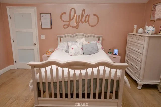 a bedroom with a bed and a bookshelf