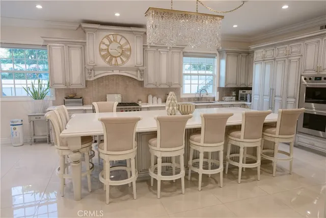 a dining room with furniture a rug and wooden floor