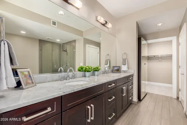 a bathroom with a sink and a large mirror