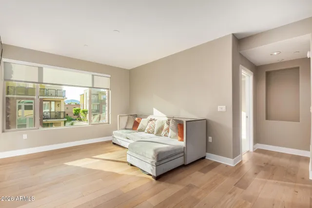 a bedroom with a large bed and a large window