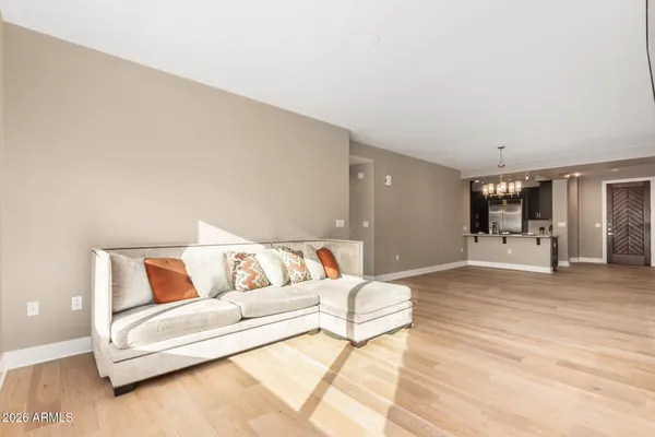 a spacious bedroom with a bed and couch