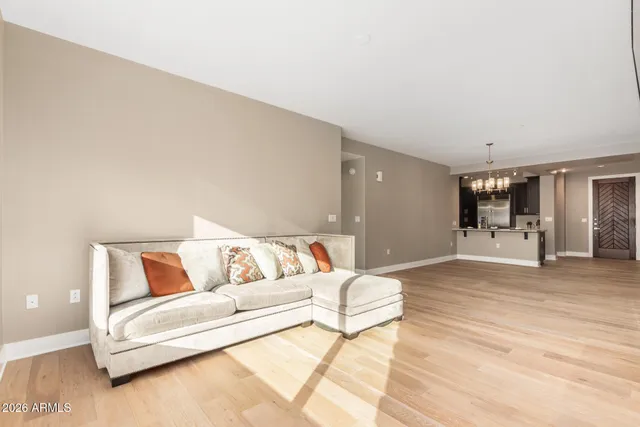 a spacious bedroom with a bed and couch