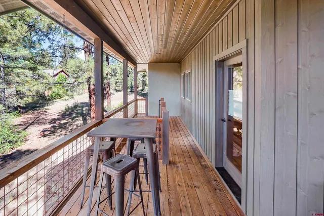 a view of a balcony with furniture