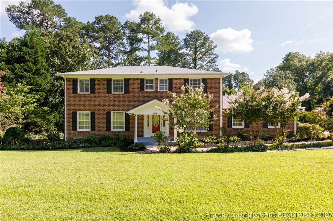 2419 Morganton Road Fayetteville, NC 28303 - Photo 1 of 44 a front view of house with yard and trees around