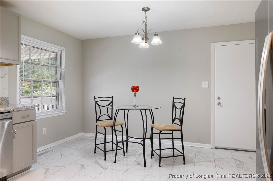 2419 Morganton Road Fayetteville, NC 28303 - Photo 12 of 44 a view of a dining room with furniture window and outside view