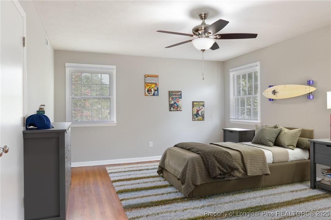 2419 Morganton Road Fayetteville, NC 28303 - Photo 20 of 44 a bedroom with a bed and a chandelier