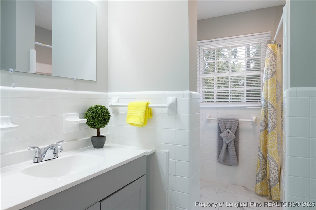 2419 Morganton Road Fayetteville, NC 28303 - Photo 24 of 44 a bathroom with a sink and a mirror